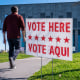 A voter enters a polling location.