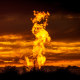 Flames from a flaring pit near a well in the Bakken Oil Field. 