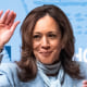 Kamala Harris waves on stage