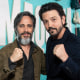 Gael Garcia Bernal, left, and Diego Luna pose for a photo together on the red carpet, holding up their fists