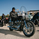 Rev. Dr. Alyn E. Waller, left, of Enon Tabernacle Baptist Church, leading the Black Men Vote Black Motorcycle Rally and Voter Registration Event in Philadelphia on Saturday, Oct. 19, 2024. Darlena Ward, right, is one of the attendees at the rally. 