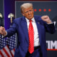 Republican presidential nominee, former U.S. President Donald Trump dances during a campaign rally on October 15, 2024 in Atlanta, Ga.