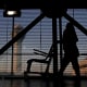 An airline employee transfers a wheelchair at O'Hare International Airport.