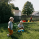 Kinser and Perry Hurley play in the backyard with their brother in Springfield, Ill., on Sept. 26, 2024.