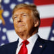 Donald Trump and a row of American flags