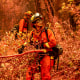 Firefighters battle the Fawn Fire burning north of Redding in Shasta County