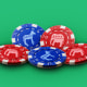 Photo Illustration: Blue and red poker chips with donkeys and elephants on them