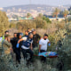 First responders carry the shrouded body of a woman who was killed when a rocket fired from Lebanon hit an area near Kiryat Ata in northern Israel's Haifa district on Oct. 31, 2024.