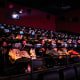 Moviegoers watch a film at an Alamo Drafthouse 