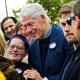 Former President Bill Clinton poses for a photograph with Carol Churchey, of Johnstown, while a campaigning for Democratic Party presidential nominee Vice President Kamala Harris during a stop at Bottle Works in the Cambria City section of Johnstown, Pa., on  Oct. 29, 2024. 