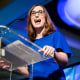 Sarah McBride speaks at a podium on stage