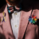 A rainbow flower sits in the jacket pocket of Scout, a transgender man at his home in Providence, R.I., June 8, 2022. The U.S. Census Bureau is on track to test questions about sexual orientation and gender identity for people age 15 and above on its most comprehensive annual survey of life in the U.S. 