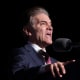 Dr. Mehmet Oz speaks as Donald Trump listens at a rally