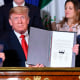 Mexican President Enrique Pena Nieto, then-President Donald Trump and Canadian Prime Minister Justin Trudeau sign a free trade agreement 