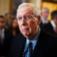 Mitch McConnell takes a question from a reporter during a news conference