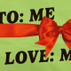 Illustration of a red ribbon wrapped over paper that reads "To: Me, Love: Me"