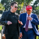 Elon Musk greets President-elect Donald Trump as he arrives to attend the launch of the SpaceX Starship rocket on Nov. 19, 2024 in Brownsville, Texas. 