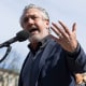 Anti-vaccine activist Del Bigtree speaks at a rally outside the Supreme Court 