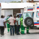 Medics inspect an ambulance of wounded people, shot by armed gangs at the General Hospital