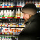 A customer stands in front of a shelf