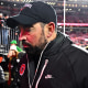 Ryan Day of the Ohio State Buckeyes walks off the field 