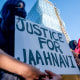 A protester holds a sign calling for justice.