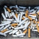 Cigarette butts piled outside