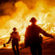 Firefighters in the middle of a wildfire.