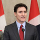 Image: Canada's Prime Minister Justin Trudeau, flanked by  Minister of Foreign Affairs Melanie Joly, left, and Minister of Finance and Intergovernmental Affairs Dominic LeBlanc.