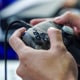 A person plays with the console.
