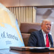 President Donald Trump next to a map showing the Gulf of America         