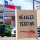 A sign is seen outside of Seminole Hospital District offering measles testing Friday, Feb. 21, 2025, in Seminole, Texas. 