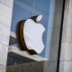 The Apple logo is seen at the entrance of an Apple store.