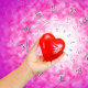 Hand holding red heart on zodiac background.