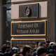 Members of the media cover a rally outside the Department of Veterans Affairs headquarters in Washington on Feb. 13, 2025.