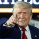 President Donald Trump arrives to deliver a speech marking his 100th day in office in Warren, Mich.