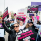 Protestors hold signs in support of Planned Parenthood