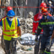 Rescue teams members carry a body from the Jet Set nightclub  