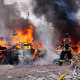 A firefighter battles a blaze at the site of a missile attack in Sumy, Ukraine