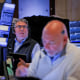 Traders work on the floor at the New York Stock Exchange on April 23, 2025. 