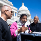From left, Hakeem Jeffries Rev. Dr. William Barber, and Cory Booker outside of the U.S. Capitol steps