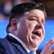 JB Pritzker speaks on stage at the DNC
