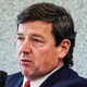 Ed Martin speaks and points while seated