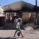 A man carries his belongings as he flees gang violence in Haiti