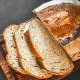 Sliced bread on dark background. Bread slices from above. Top view