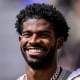  Shedeur Sanders smiling during a ceremony to retire his jersey 