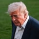 President Donald Trump leaves after taking questions from reporters