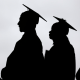 New graduates line up before the start of a commencement.