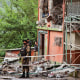 Army soldiers stand guard at a mosque building damaged by a suspected Indian missile attack near Muzaffarabad
