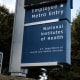 A blue National Institutes of Health sign outside